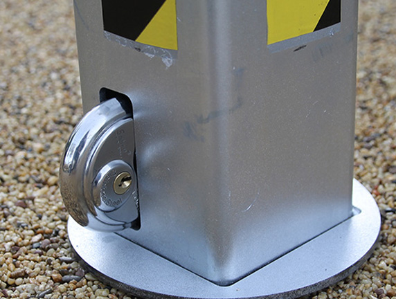 Anti ram bollard locking mechanism with security padlock